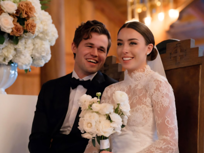 Magnus Carlsen celebrates rating with his wife.